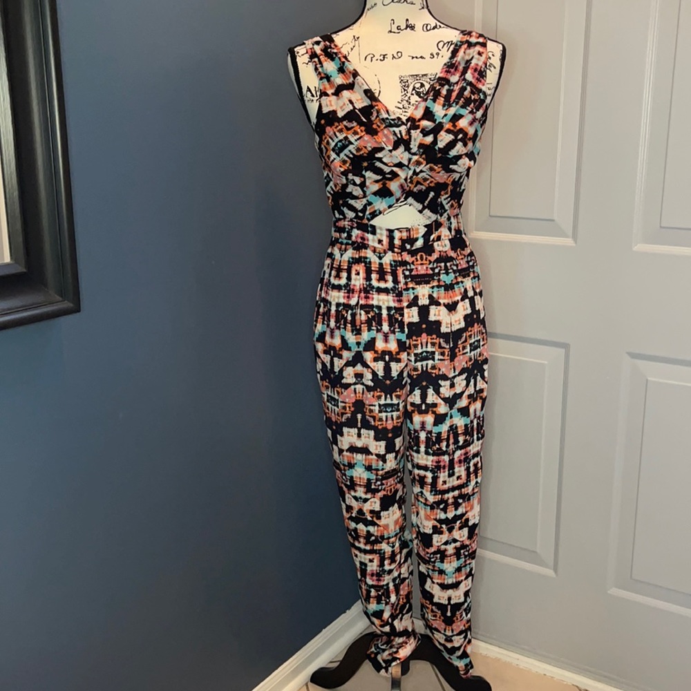 NWOT Glam Doll Graphic print Cut Out Jumpsuit